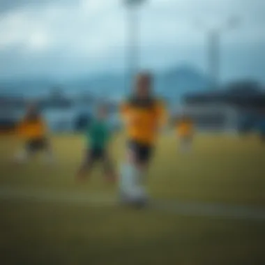 Young athletes practicing football at a community field in Reykjavik.
